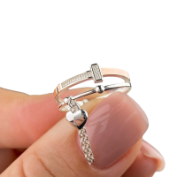 Жіночі срібна каблучка з золотими вставками та підвіскою. 1592-17